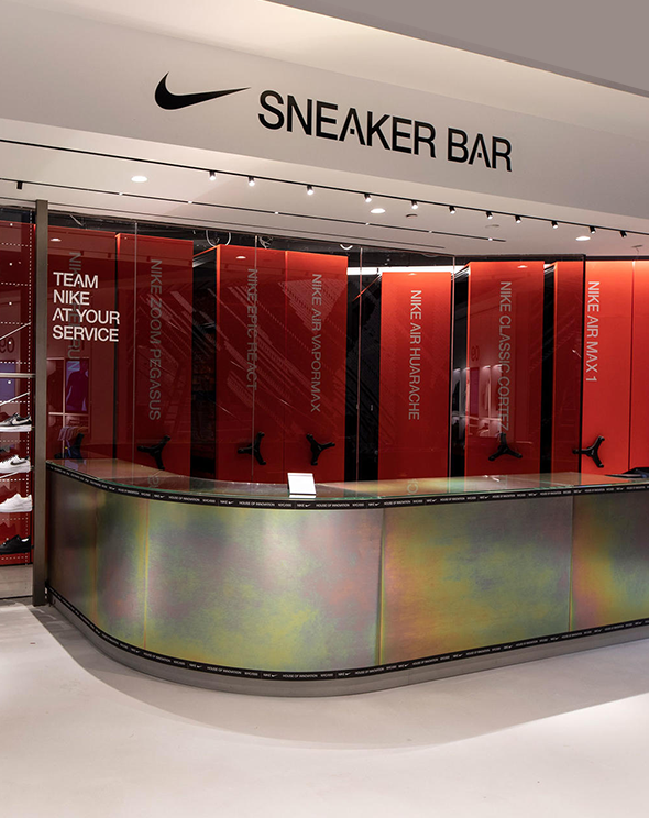 Nike NYC flagship store's sneaker bar front desk, creating organic retail experiences