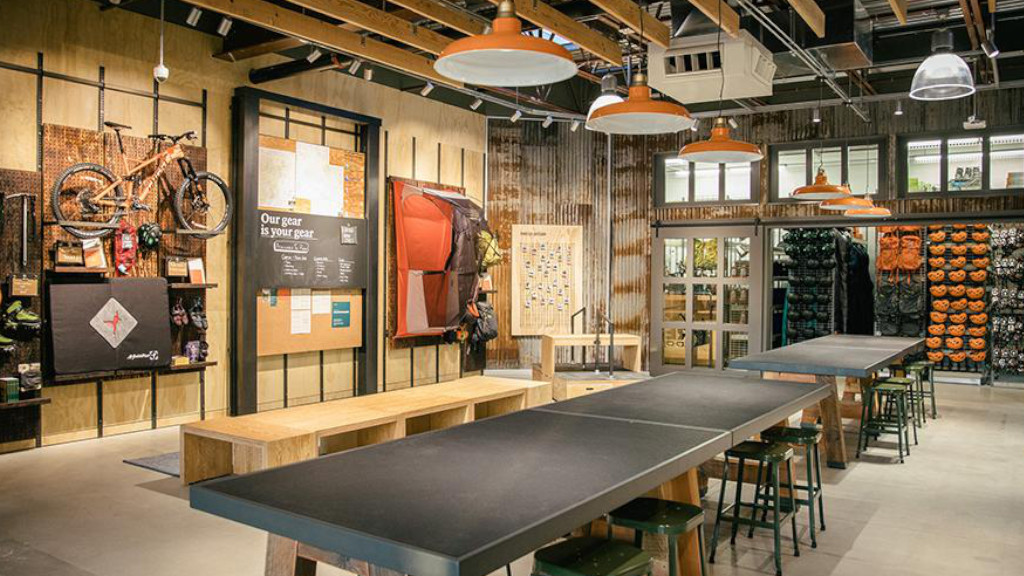 REI co-op's new store concept with instore seating and tables for more organic retail experiences