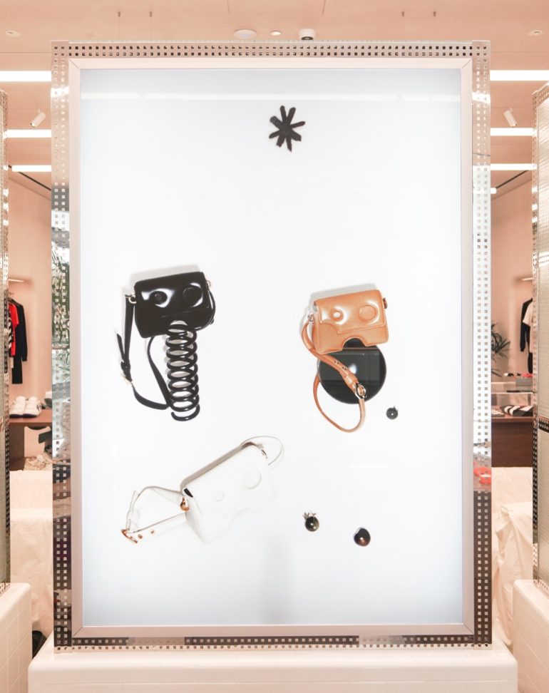 Luxury brand, Off-White, modular approach to the retail experiences with a white, a black, and a brown purse on display