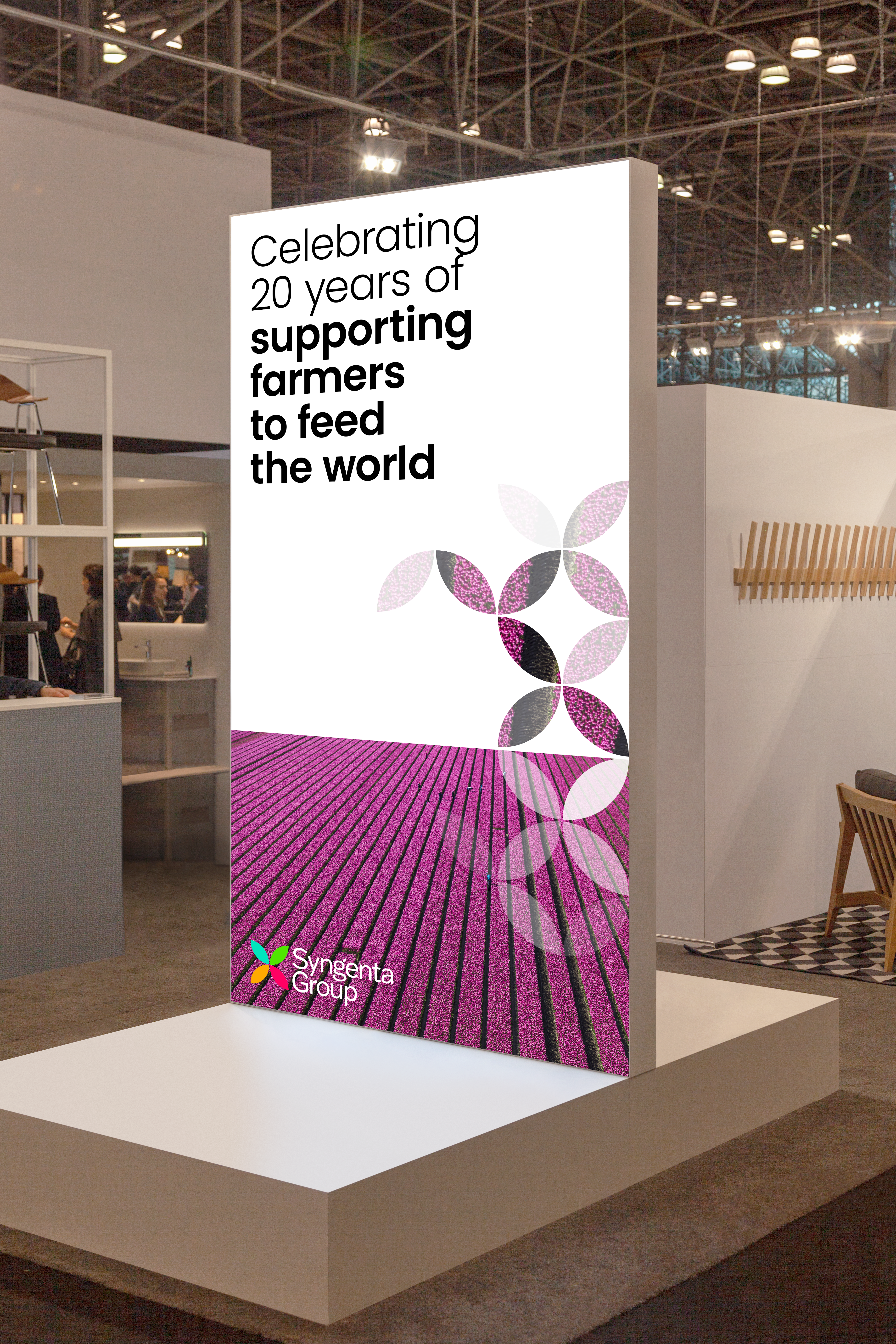 Syngenta Group white and purple lift display that says ‘Celebrating 20 years of supporting farmers to feed the world’